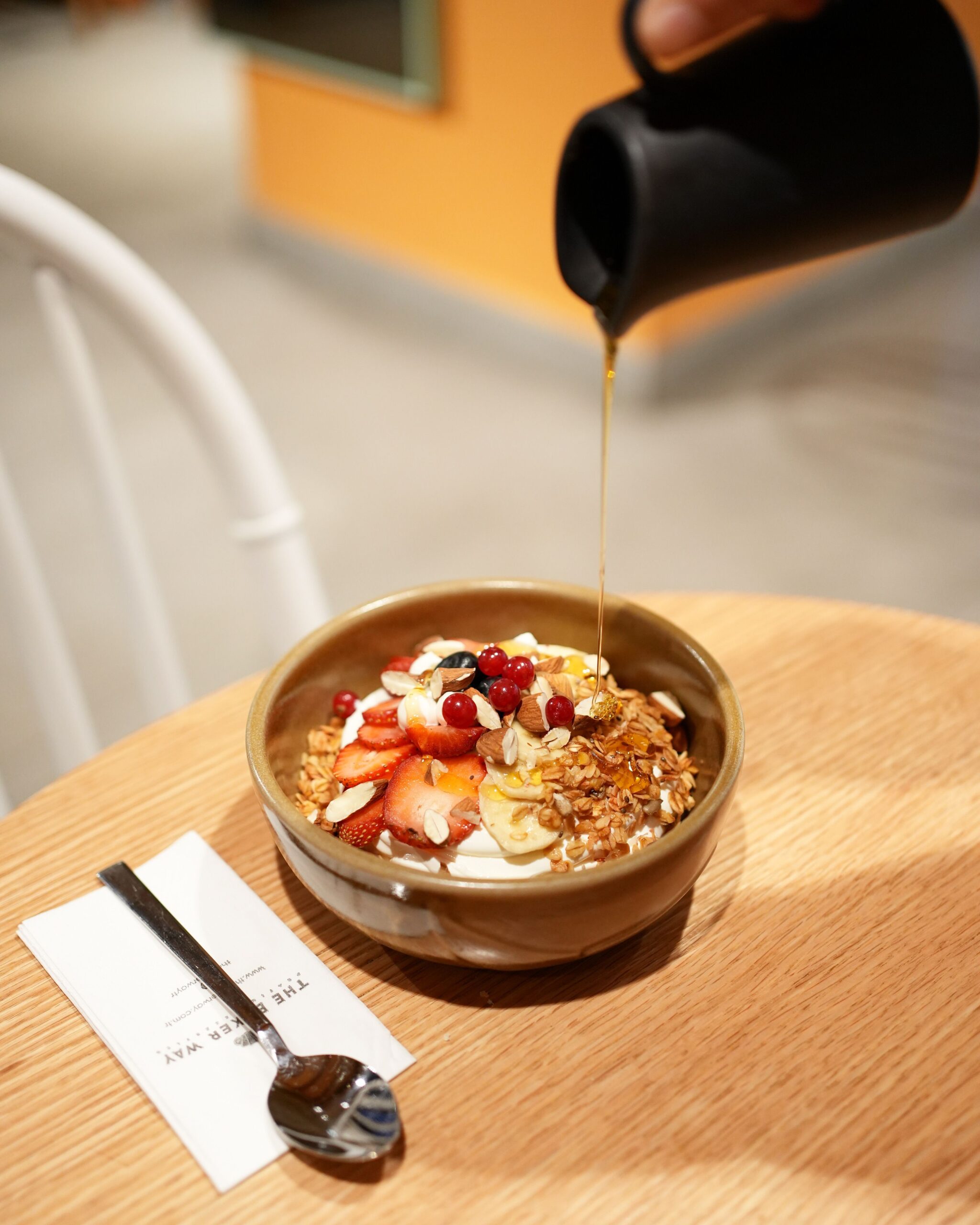 Greek yogurt topped with berries and a drizzle of honey